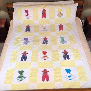 Sunbonnet Sue yellow and cream hand sewn quilt